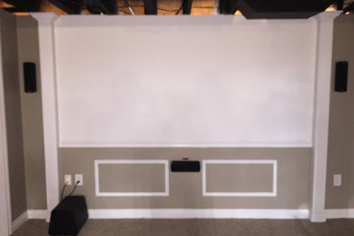 Home theater - mid-sized contemporary home theater idea in Detroit