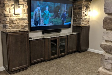 Home theater - rustic home theater idea in Cleveland