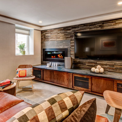 Mid-sized trendy enclosed concrete floor home theater photo in Los Angeles with beige walls and a wall-mounted tv