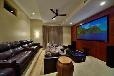 Home theater - mid-sized home theater idea in Salt Lake City with beige walls and a wall-mounted tv