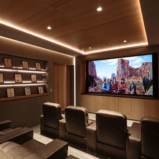 Example of a trendy enclosed carpeted and gray floor home theater design in Los Angeles with gray walls