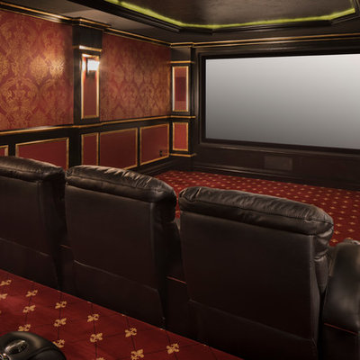 Elegant enclosed carpeted and red floor home theater photo in New York with red walls