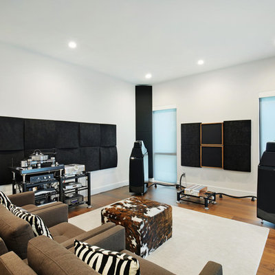 Example of a small minimalist enclosed home theater design in Tampa