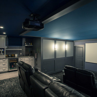 Inspiration for a large contemporary enclosed carpeted and blue floor home theater remodel in DC Metro with gray walls and a projector screen