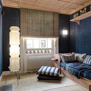 Inspiration for a medium sized world-inspired home cinema in London with blue walls and a projector screen.