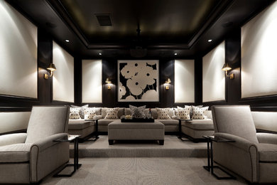 Large elegant enclosed carpeted and gray floor home theater photo in Miami with black walls and a projector screen