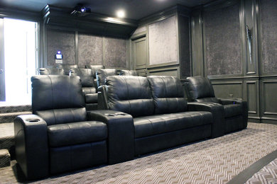 Inspiration for a large timeless enclosed carpeted and multicolored floor home theater remodel in Dallas with gray walls and a projector screen