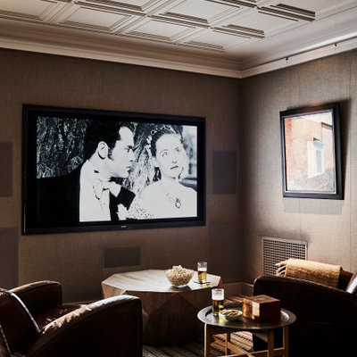 Home theater - small coastal carpeted home theater idea in Los Angeles with a wall-mounted tv