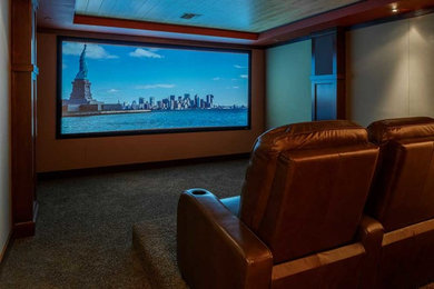 This is an example of a medium sized classic enclosed home cinema in Seattle with beige walls, carpet and a projector screen.