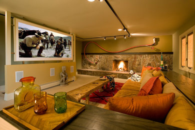 Home theater - eclectic home theater idea in Albuquerque with a projector screen