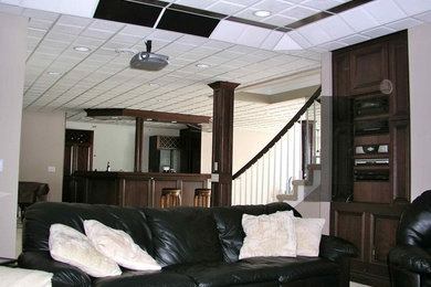 Inspiration for a mid-sized timeless open concept carpeted home theater remodel in Detroit with white walls and a projector screen