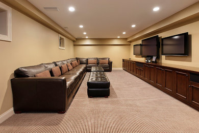 Large transitional enclosed carpeted and multicolored floor home theater photo in Detroit with beige walls and a wall-mounted tv