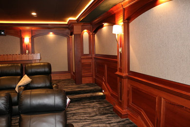 Inspiration for a medium sized classic enclosed home cinema in Boston with grey walls, carpet and a projector screen.