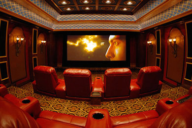 Home theater - traditional carpeted home theater idea in Phoenix with red walls and a projector screen
