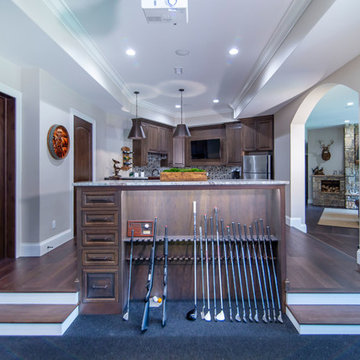 Golf simulator and bar area in basement of mountain home. Dura Supr