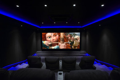 Inspiration for a contemporary home cinema in West Midlands.