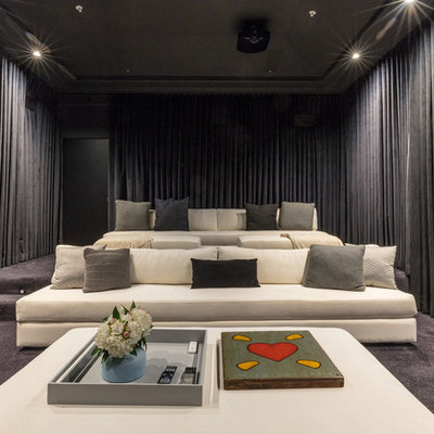 Inspiration for a transitional enclosed carpeted and gray floor home theater remodel in Los Angeles with a projector screen