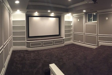 Mid-sized transitional enclosed ceramic tile and gray floor home theater photo in Chicago with gray walls and a projector screen