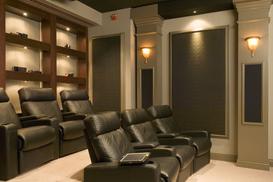 Example of a mid-sized classic enclosed carpeted home theater design in Other with beige walls