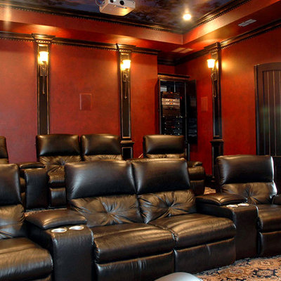 Example of a large classic enclosed carpeted and multicolored floor home theater design in Austin with red walls and a projector screen