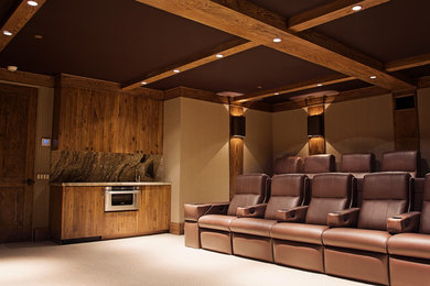 Home theater - large traditional enclosed carpeted home theater idea in Los Angeles with a projector screen