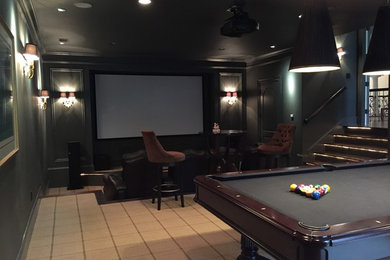 Large enclosed carpeted home theater photo in Charleston with gray walls and a projector screen