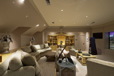 Example of a huge trendy enclosed carpeted home theater design in Houston with a projector screen and beige walls