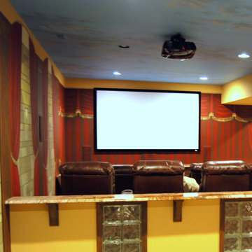 Home Theater with hand-painted decorative touches all throughout the room.