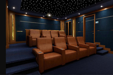 Large trendy enclosed carpeted and blue floor home theater photo in Miami with blue walls and a projector screen