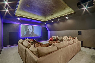 Inspiration for a mid-sized timeless enclosed carpeted home theater remodel in Oklahoma City with gray walls and a projector screen