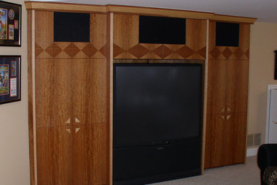 Photo of a large modern enclosed home cinema in Other with beige walls, carpet and a built-in media unit.