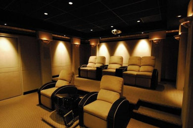 Design ideas for a medium sized traditional enclosed home cinema in Raleigh with beige walls, carpet, a projector screen and beige floors.
