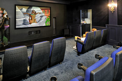 Home theater - large home theater idea in Houston with a wall-mounted tv