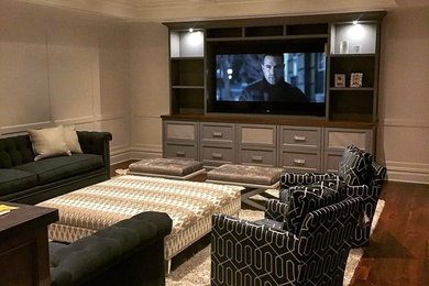 Trendy home theater photo in New York with a media wall