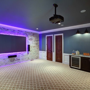 Example of a large transitional enclosed carpeted home theater design in Oklahoma City with blue walls and a wall-mounted tv