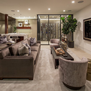 Example of a trendy open concept carpeted and gray floor home theater design in Orange County with beige walls