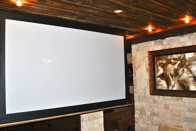 Inspiration for a rustic home theater remodel in New York