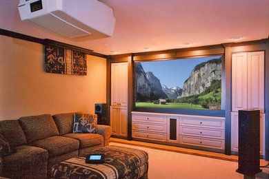 Mid-sized elegant enclosed carpeted and brown floor home theater photo in Toronto with brown walls and a projector screen