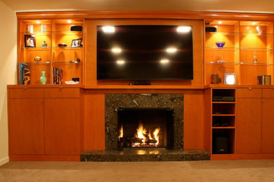 Inspiration for a midcentury enclosed home cinema in Seattle with carpet and a wall mounted tv.