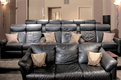 Home theater - large traditional enclosed carpeted and brown floor home theater idea in San Francisco with beige walls