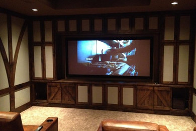 Photo of a medium sized home cinema in Atlanta with beige walls, carpet and a wall mounted tv.