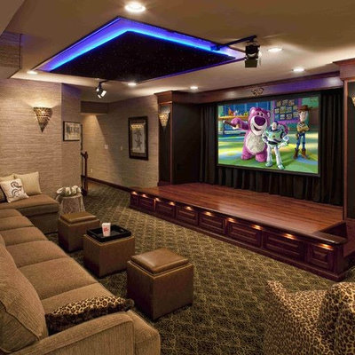 Inspiration for an enclosed carpeted home theater remodel in Chicago with beige walls and a projector screen