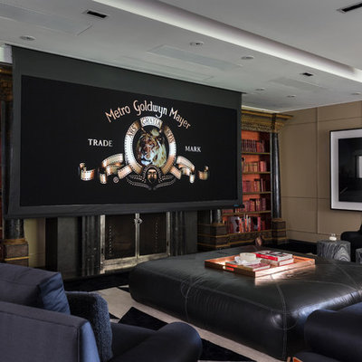 Home theater - huge traditional open concept carpeted and black floor home theater idea in Los Angeles with beige walls and a media wall
