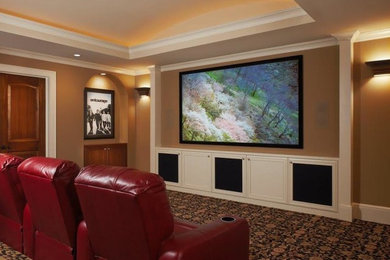 Inspiration for a mid-sized timeless enclosed carpeted home theater remodel in Detroit with beige walls and a projector screen