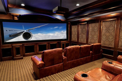 Mid-sized elegant enclosed carpeted home theater photo in Birmingham with a projector screen