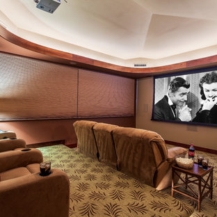 Large island style enclosed carpeted home theater photo in Hawaii with a projector screen