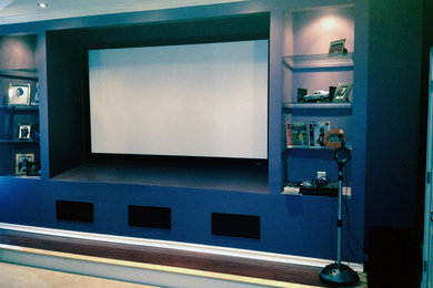 Example of a trendy home theater design in Raleigh