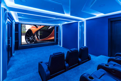 Design ideas for a contemporary home cinema in Edmonton with a projector screen.