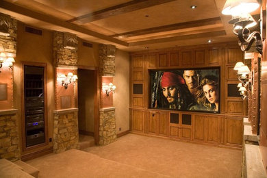 Example of a classic enclosed carpeted home theater design in Phoenix with beige walls and a wall-mounted tv