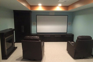 Home theater - home theater idea in Minneapolis with beige walls and a projector screen